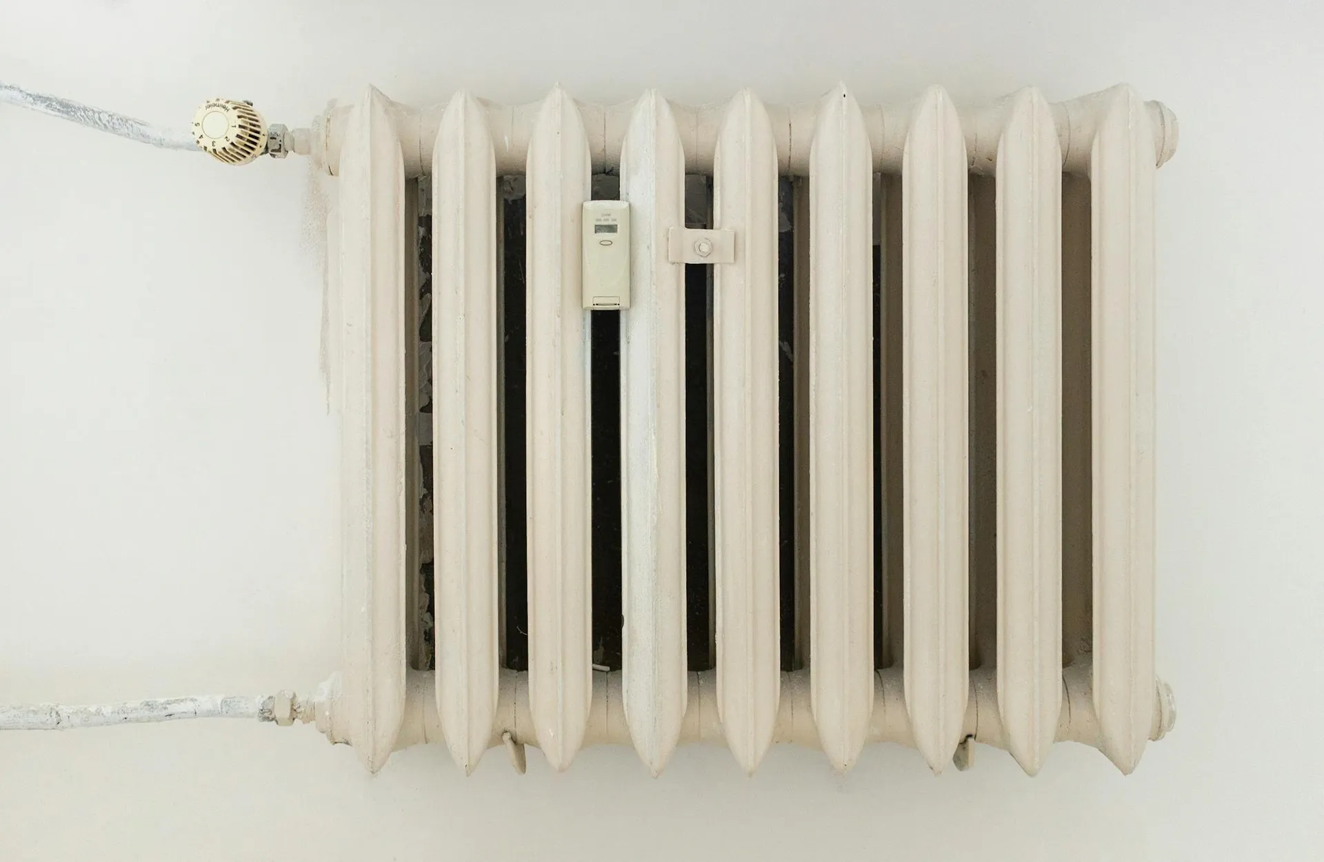 Cast-iron radiator on a plaster wall in a 1930s Leicestershire semi
